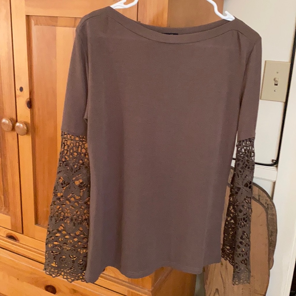 Brown shirt with Lacey arms. Never worn.